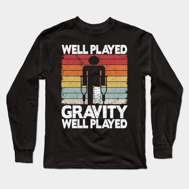 Well Played Gravity Funny Broken Ley Get Well Soon Long Sleeve T-Shirt by Kuehni